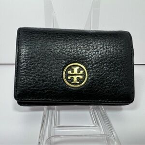 2110: Tory Burch Black Pebbled Leather Flap Wallet Logo Medallion